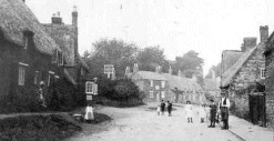 Main Road, Duston, in 1885, with children in their best Sunday clothes